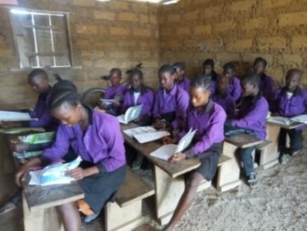 School children in classroom with learning materials